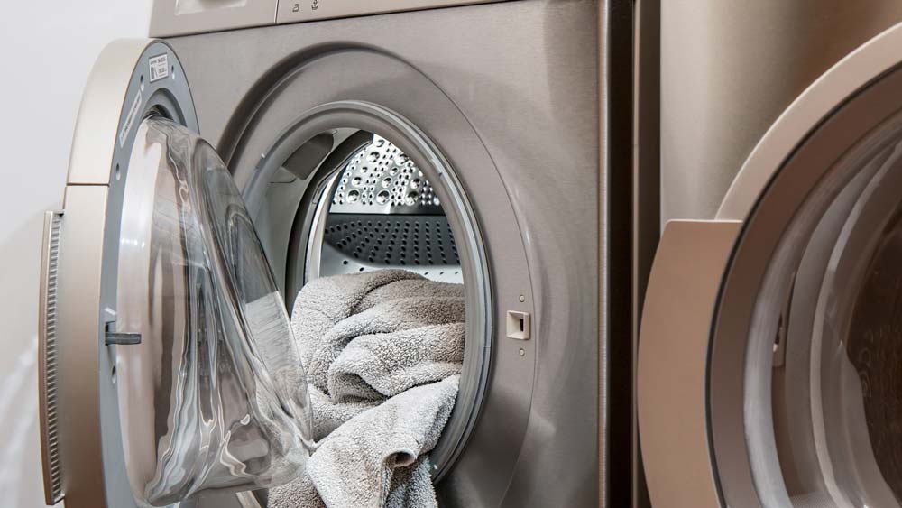 A clothes dryer with clean towels in it