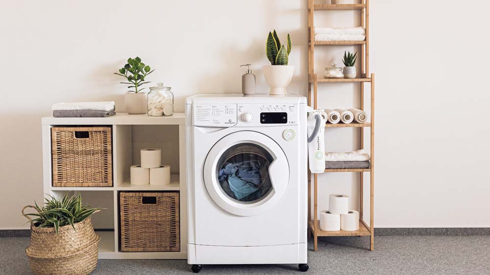 A clean, organized laundry room with a washer/dryer